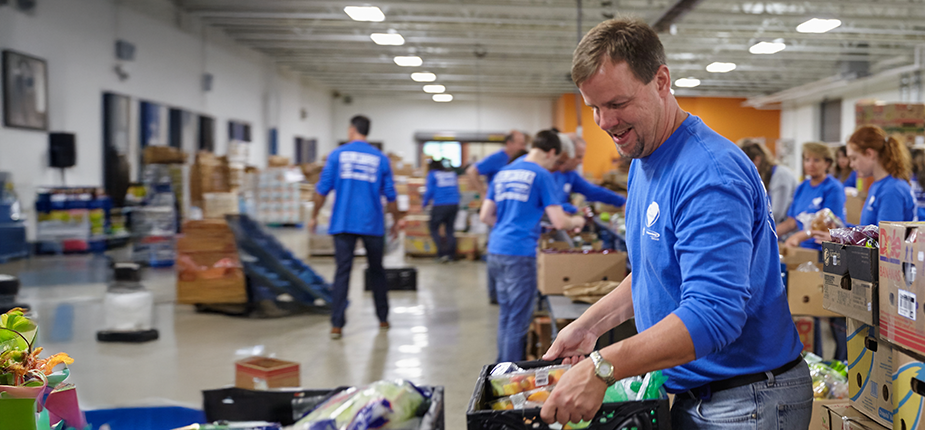 Consumers Energy volunteer helping at a local food bank